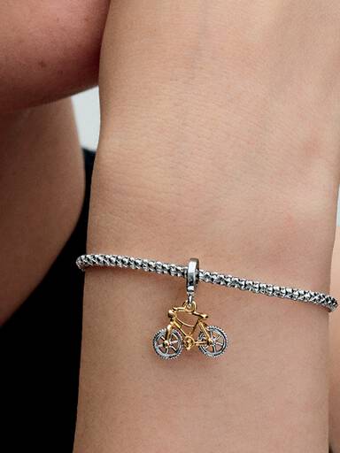 Dwutonowy charms-zawieszka Rower na obrotowych kołach