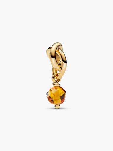 Fasetowany charms-zawieszka Miodowy symbol wieczności